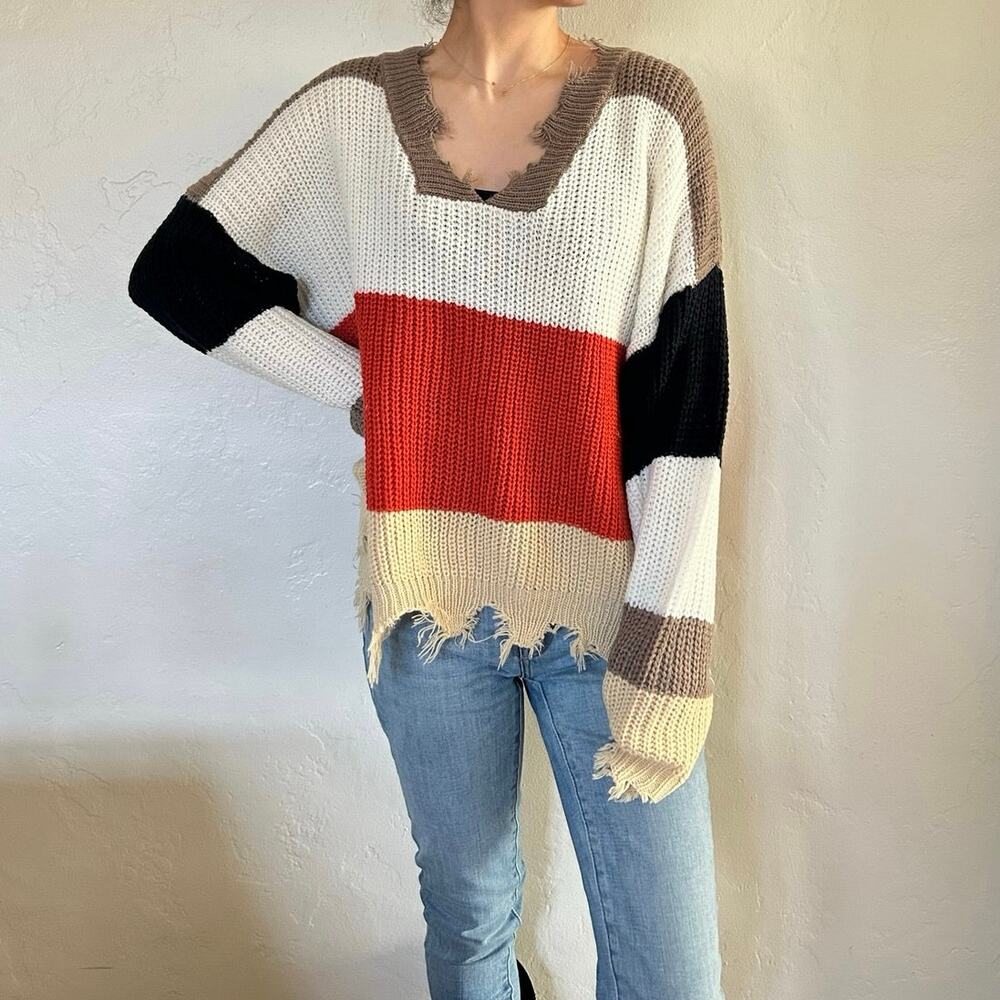 Distressed striped sweater